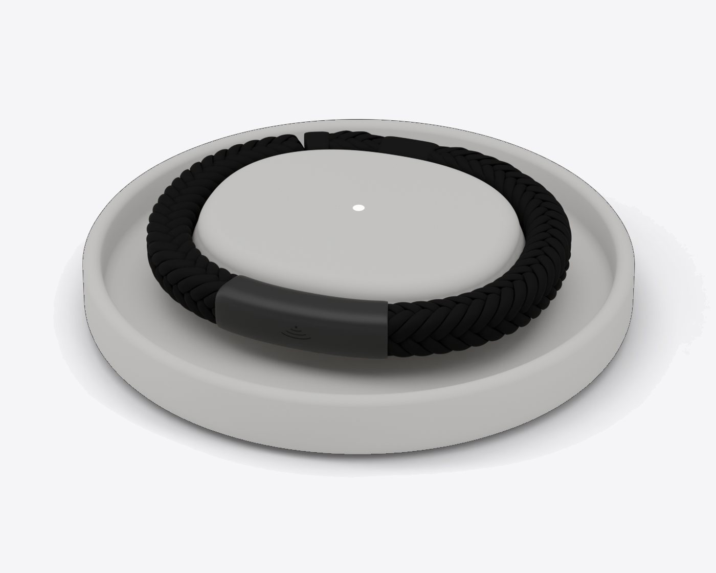 Locara resting on its stone grey charging dish, with a small light glowing in the middle